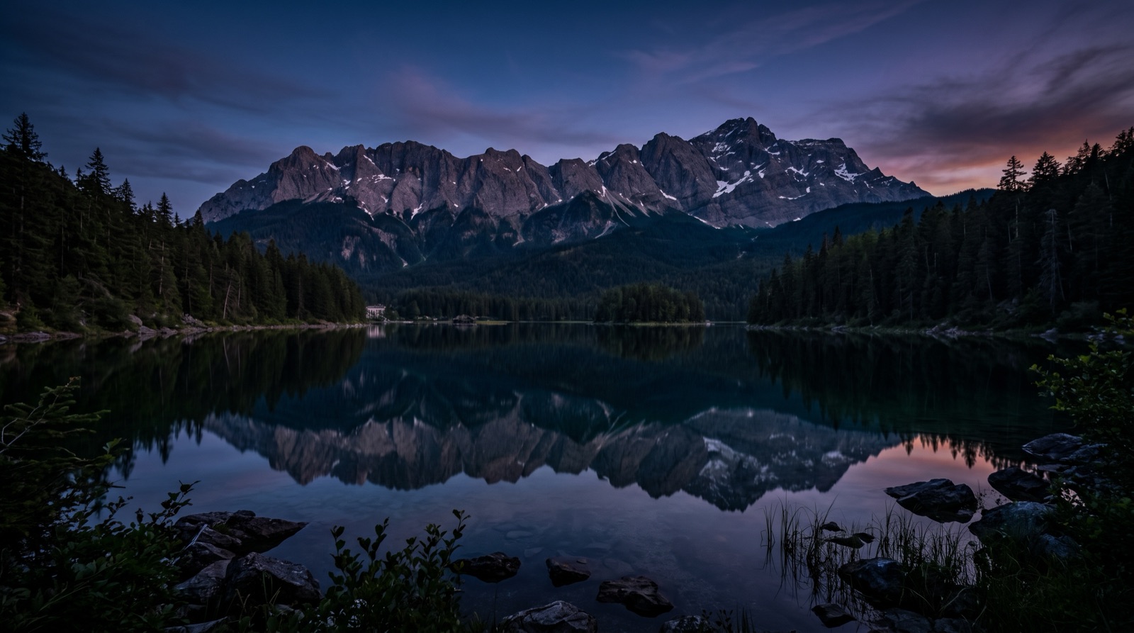 A still mountain lake with a mirror reflection