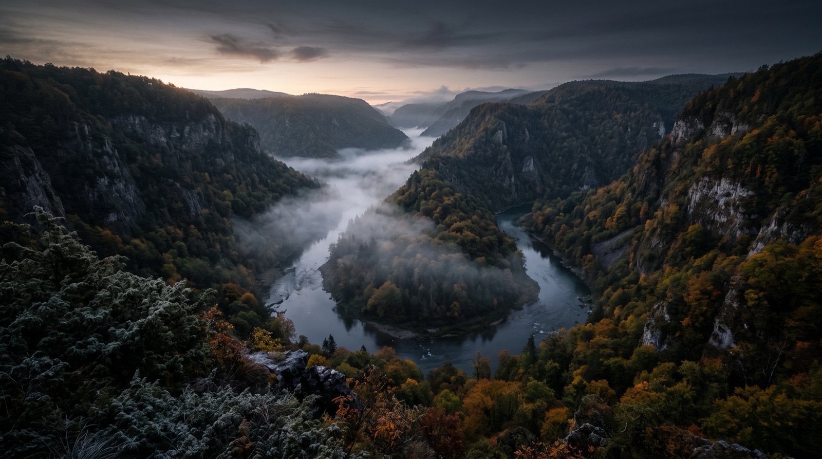 A misty tailwater river winding through a canyon