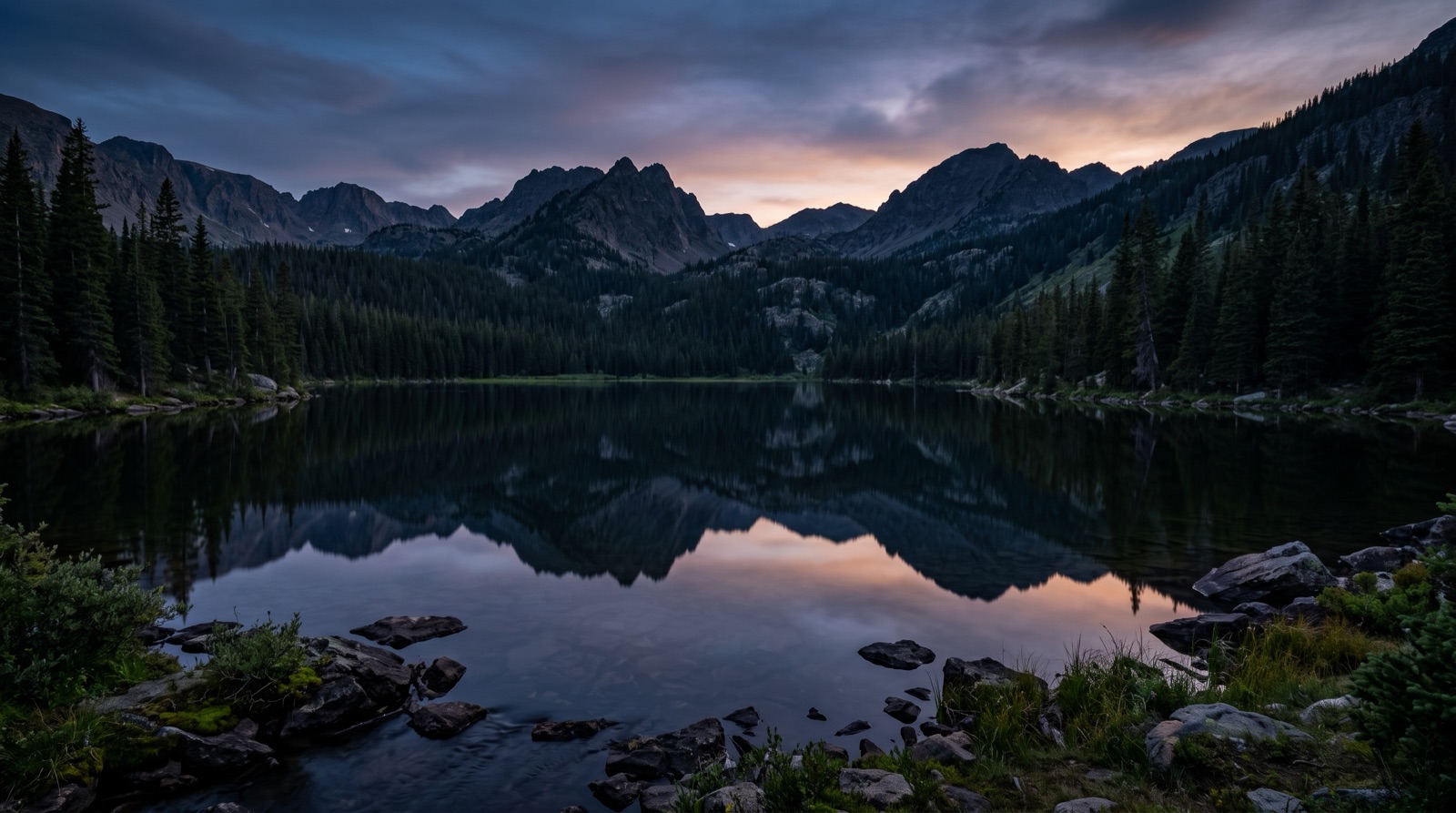 A still mountain lake with a mirror reflection
